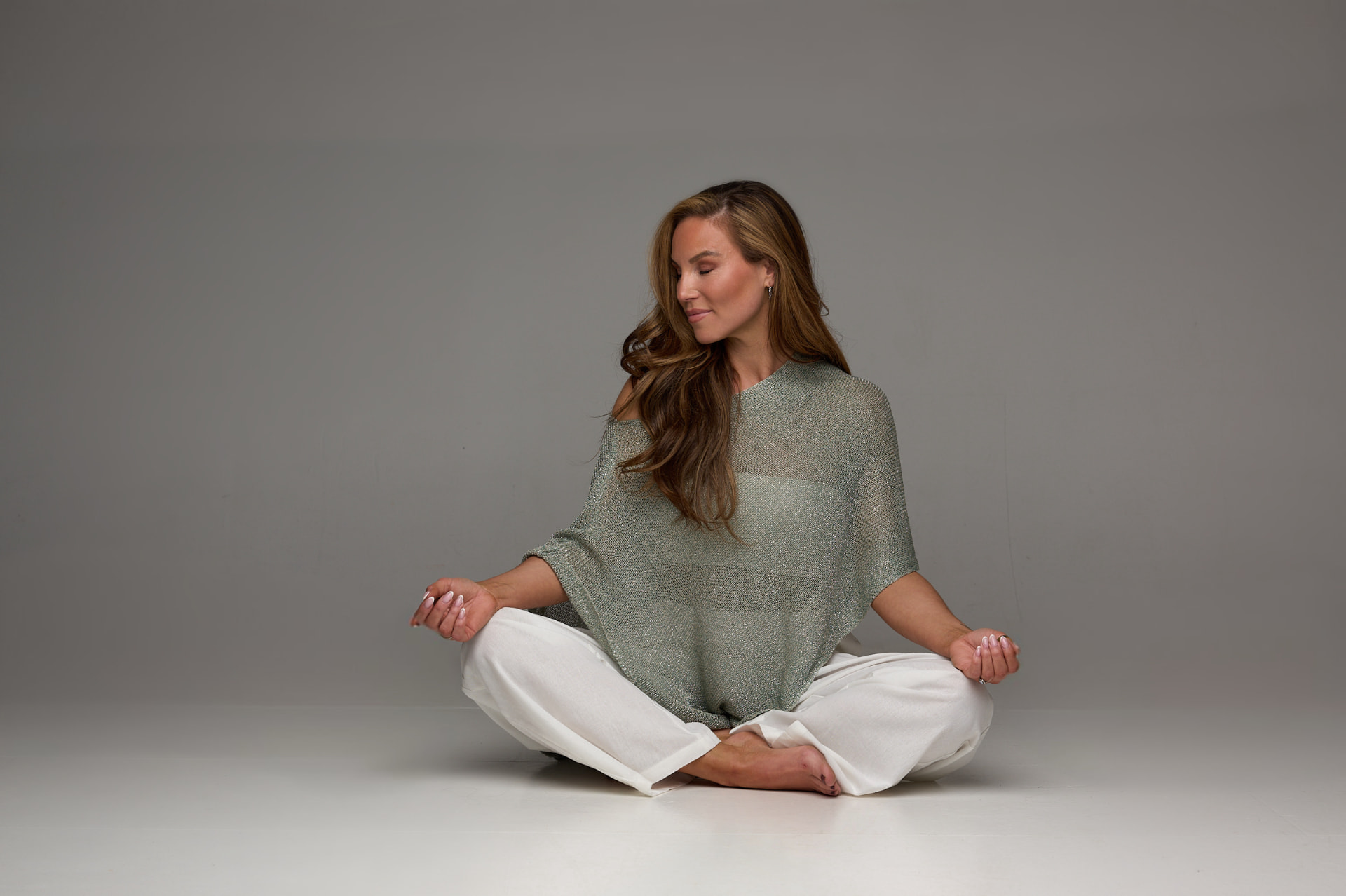 Maria Fagranes seated cross-legged in meditation
